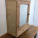 Small glass wall cabinet from the 1960s.