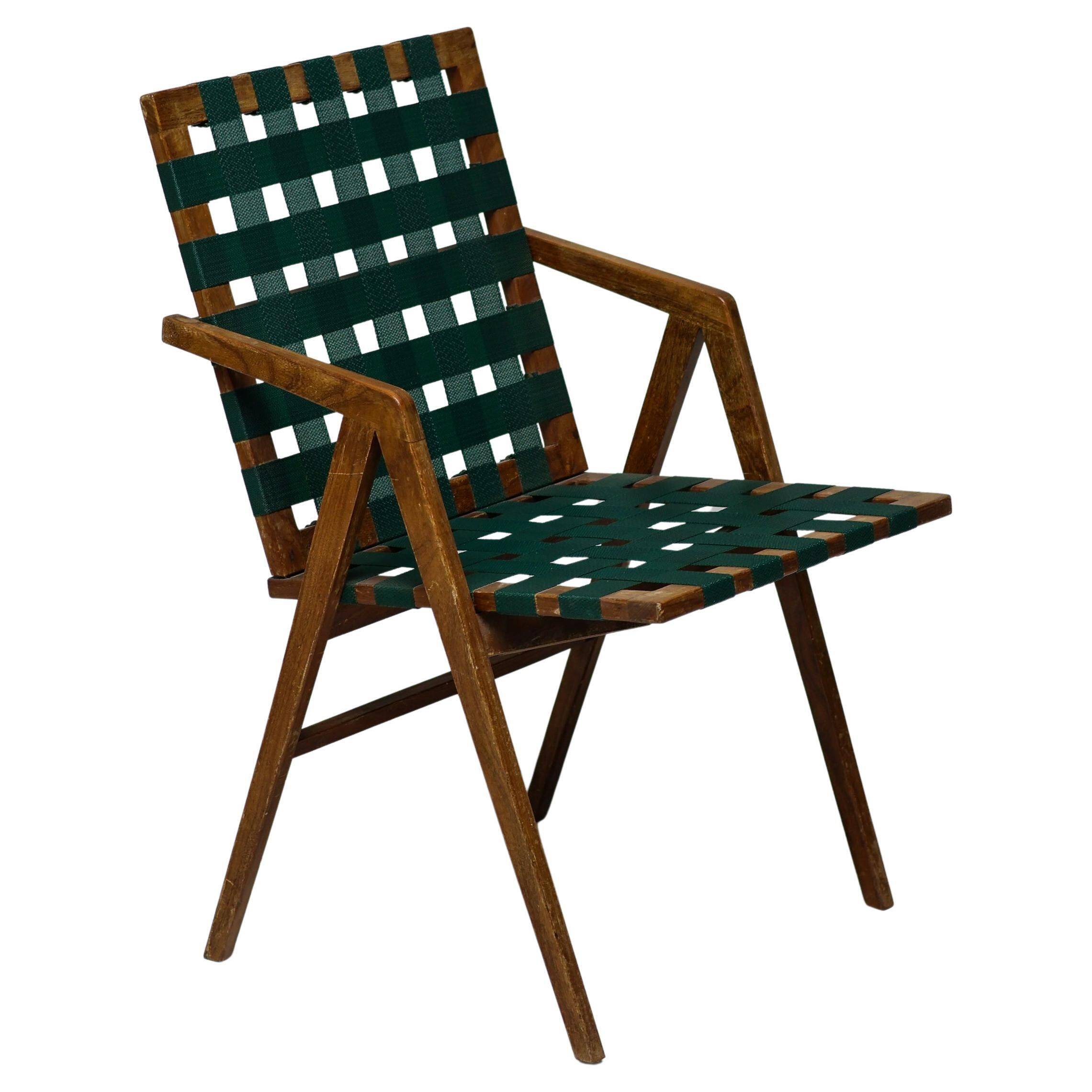Mid-century Italian armchair in walnut with straps, in the style of Franco Albini.