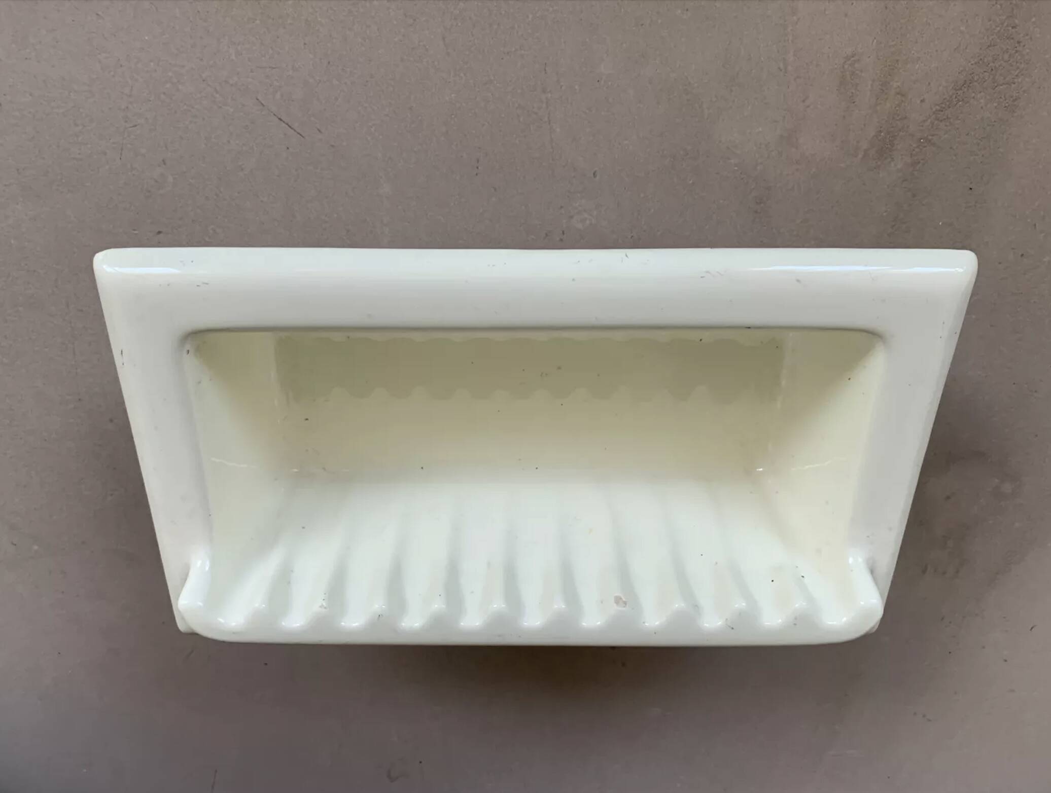 Recessed wall-mounted soap dish