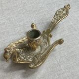 Bronze hand candlestick in the shape of a peacock