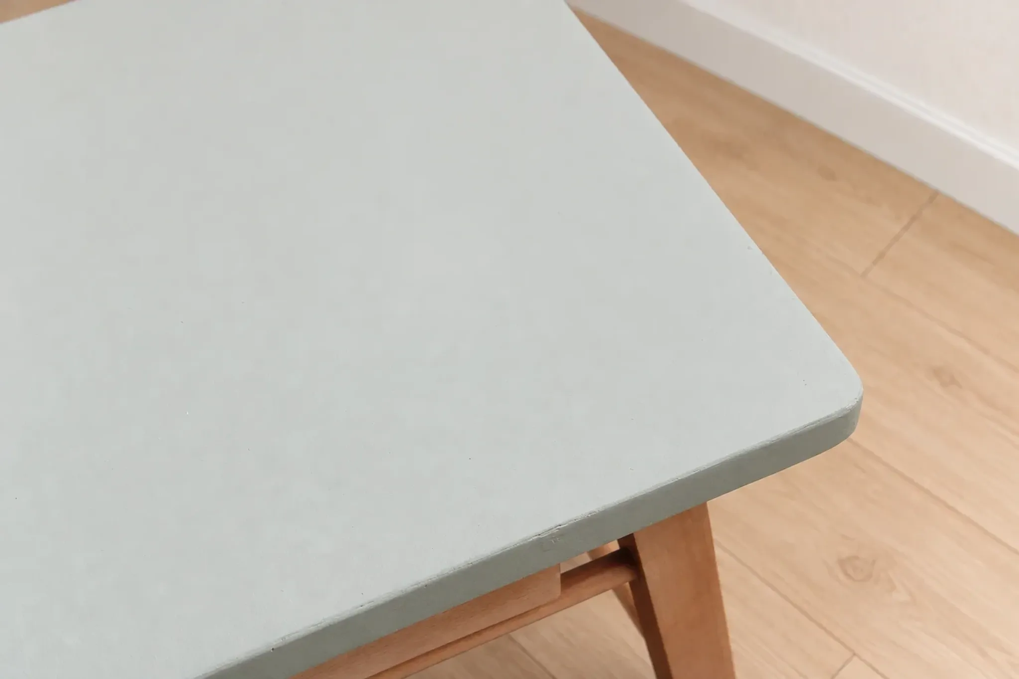 Small vintage children's desk attributed to Baumann – natural wood and lizard green top.
