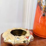 Golden brass ashtray with bamboo decoration.