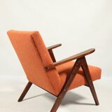 Vintage orange curly armchair Scandinavian design 1970
