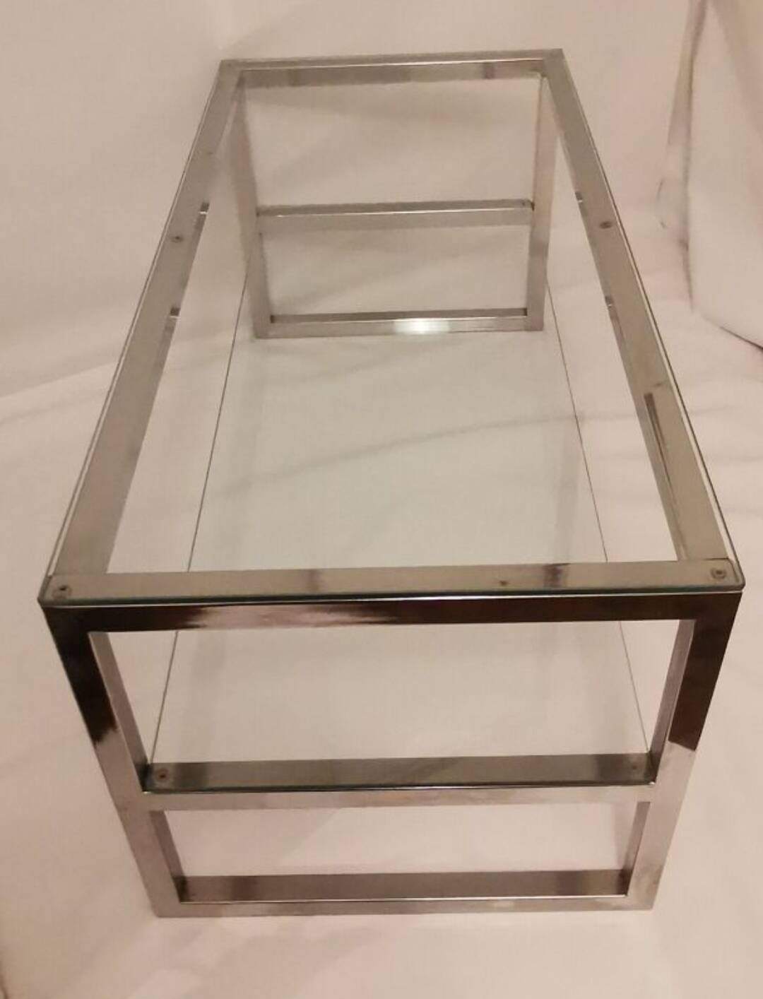 1980s coffee table with a double chrome metal top.