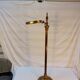 Old golden brass towel rack on baroque style foot