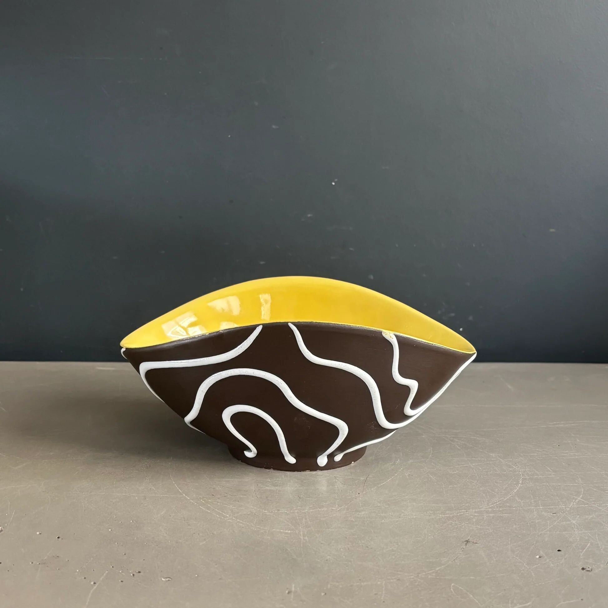 Yellow and black ceramic aperitif bowl, free form, West Germany.