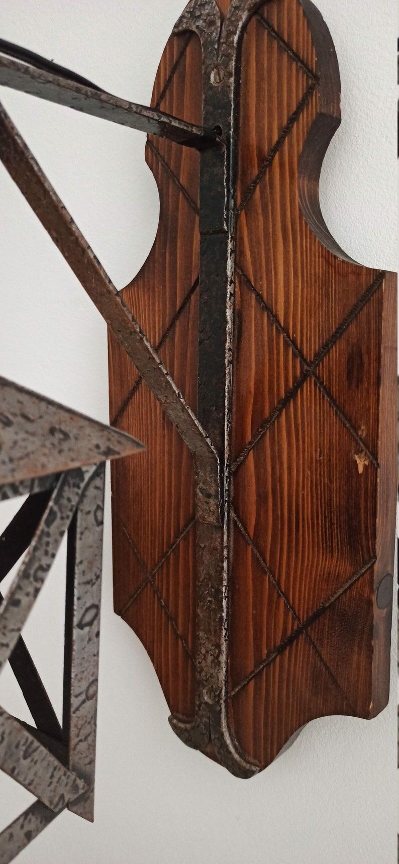 Wall lamp in wrought iron and old wood