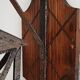 Wall lamp in wrought iron and old wood
