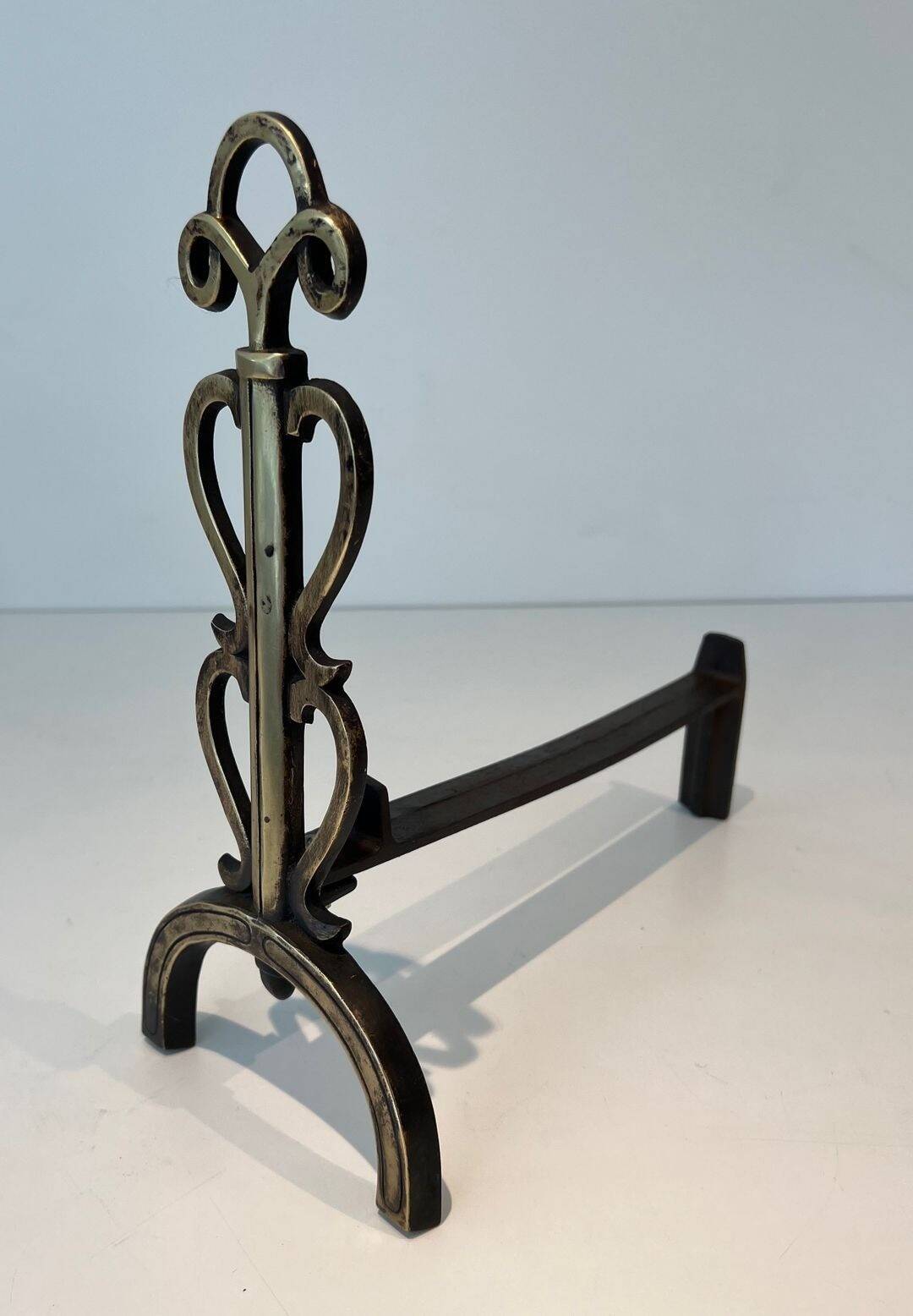 Pair of Brass and Wrought Iron Chenets with Triple Volute and Mount Torch Holders