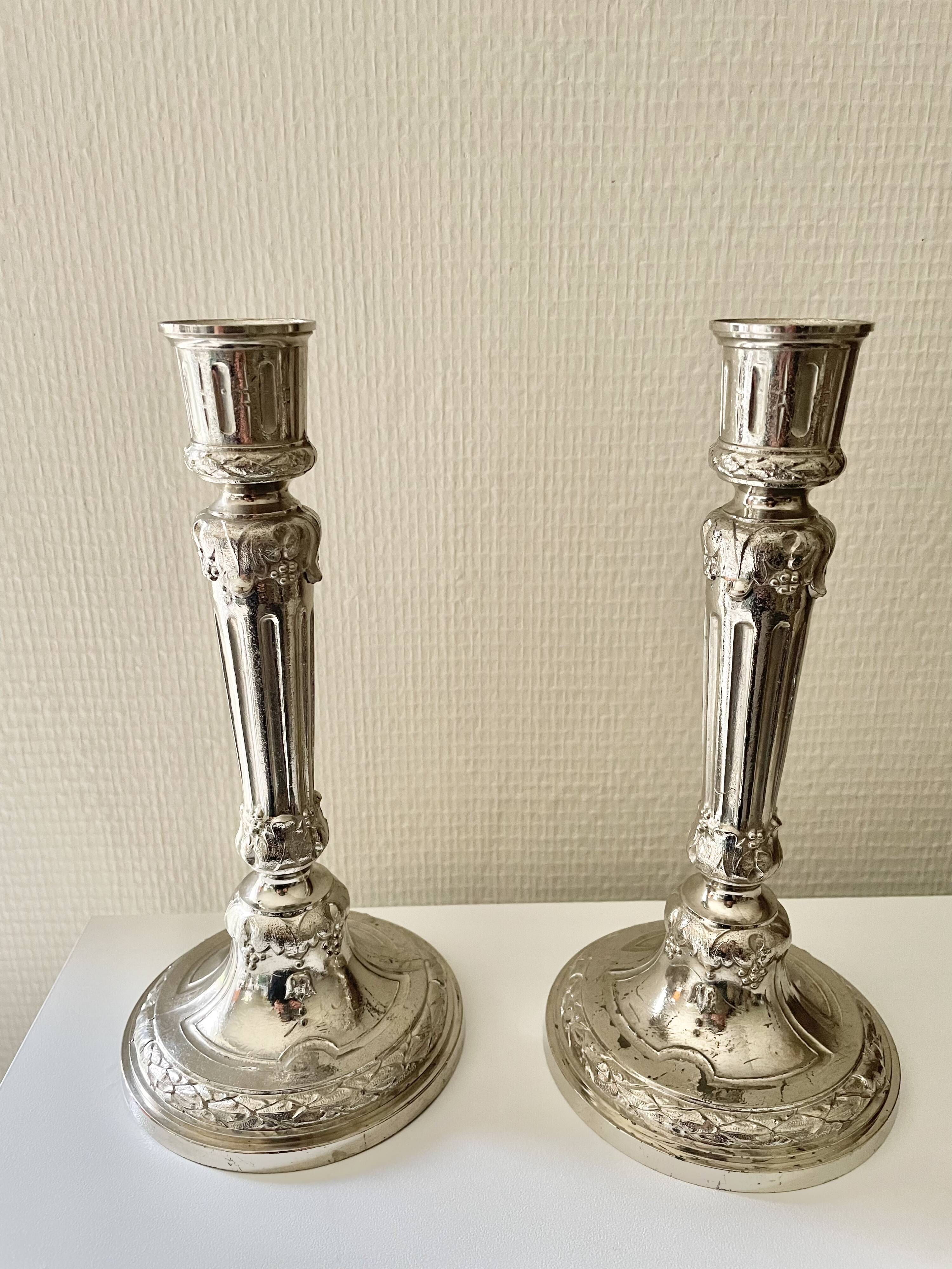Antique silver-plated candlesticks in classic style