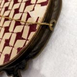 Gilded bronze mirror with angels and scrolls