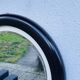 Round vintage mirror in brown resin – 1970s modernist design