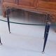 Table basse 1950 ovale en verre acier et laiton