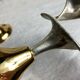 Pair of silver and gold metal candlesticks