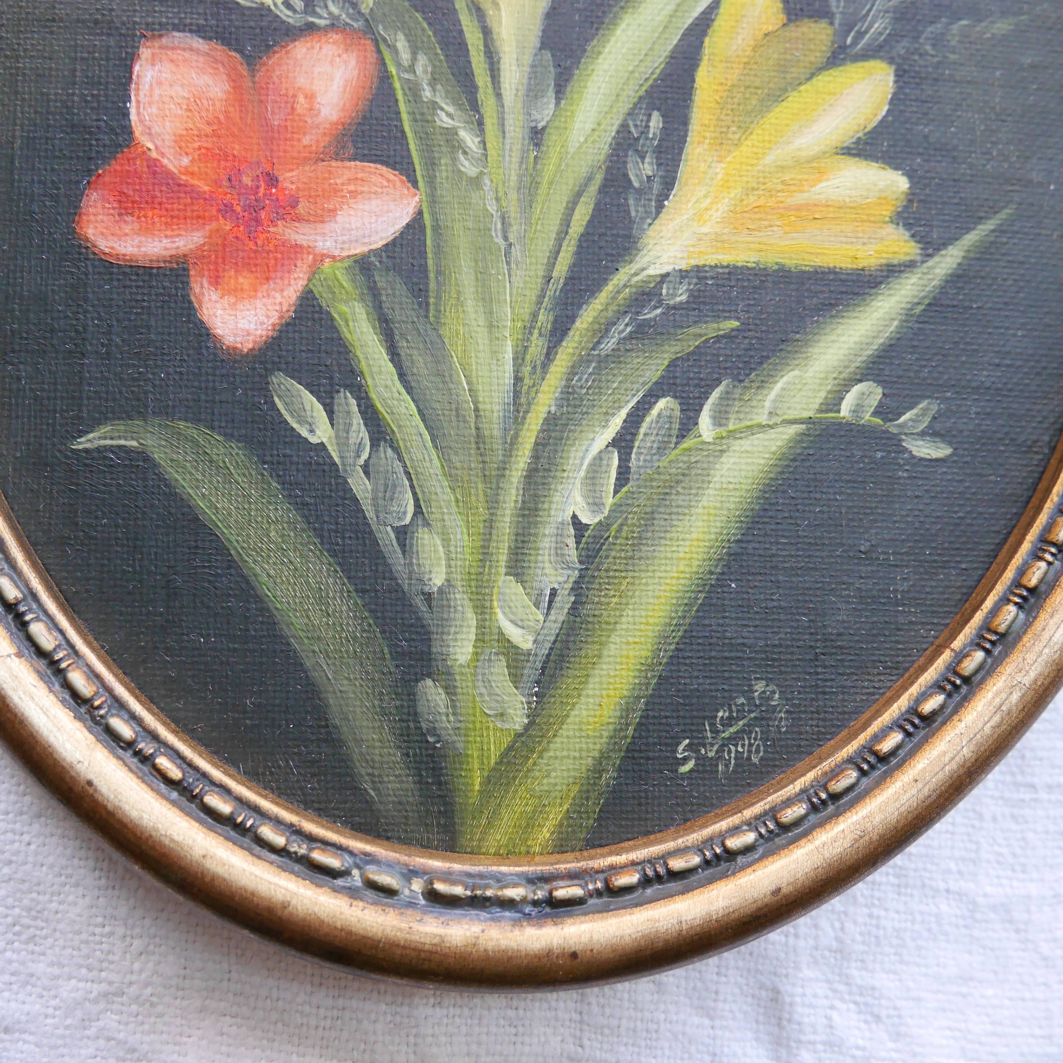 Set of 2 small oval paintings, flowers
