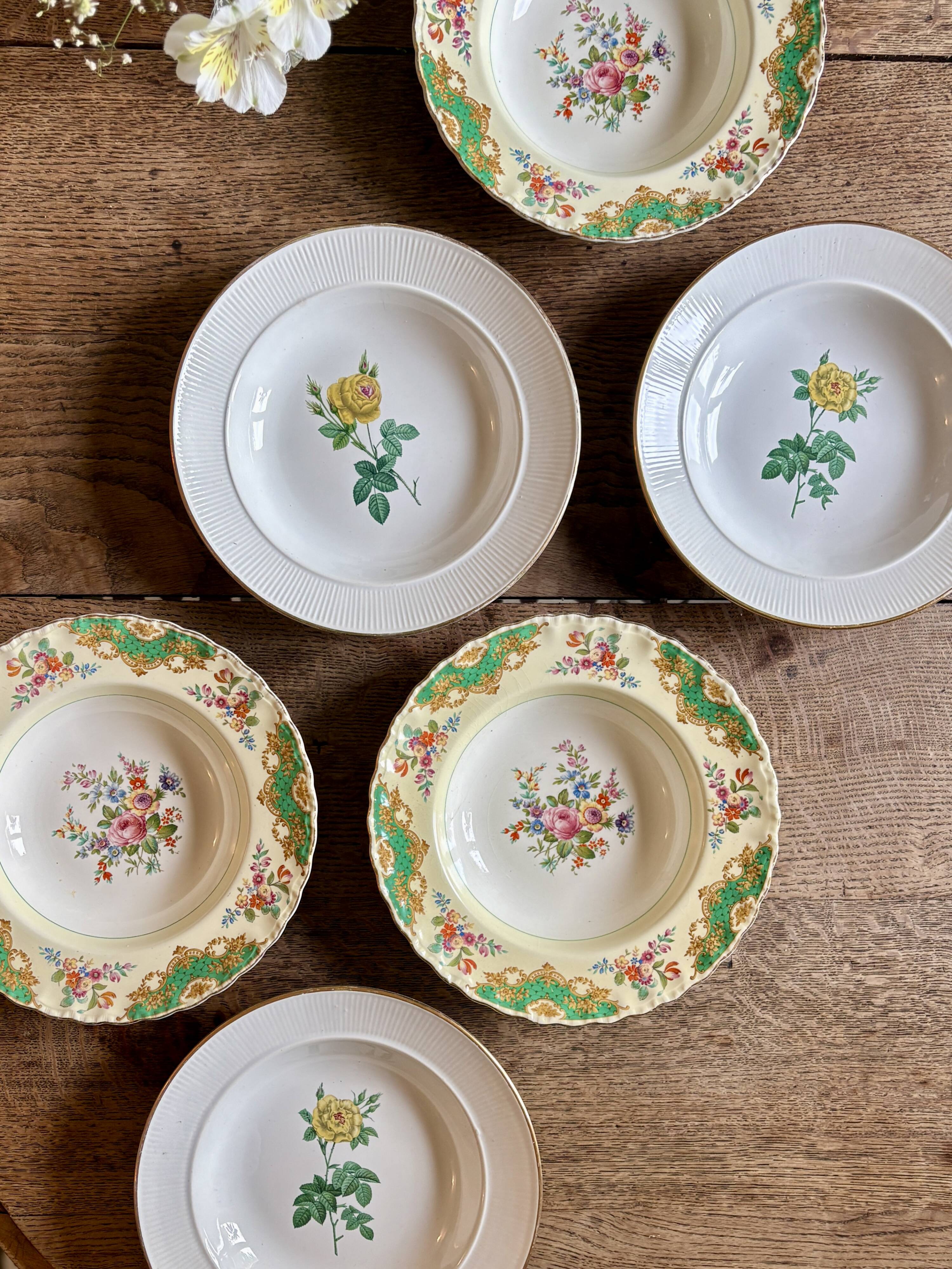 Set of 6 mismatched antique deep plates.