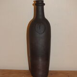 Old terracotta bottle with small spout