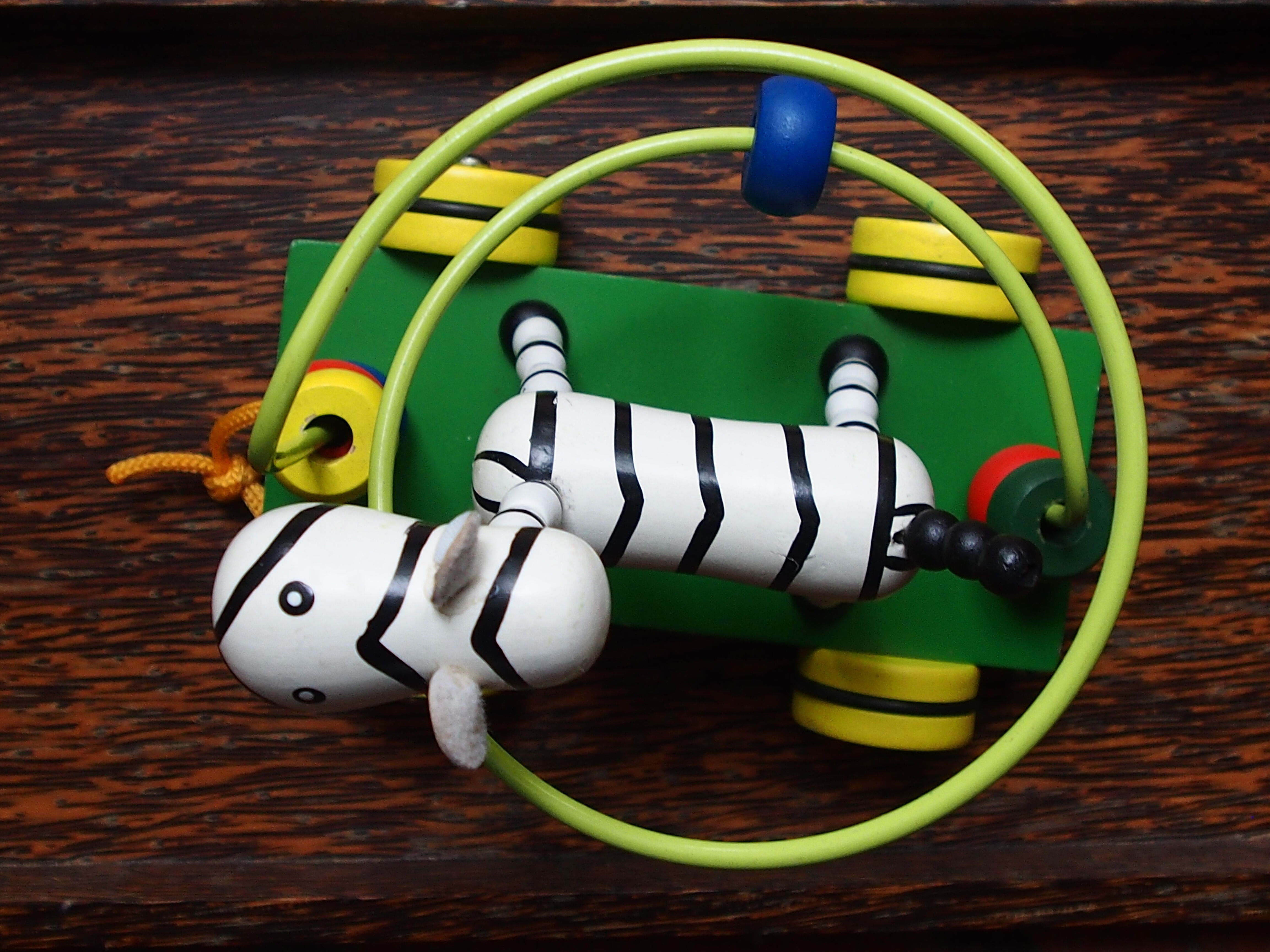 Old wooden toy, zebra car, to pull and push