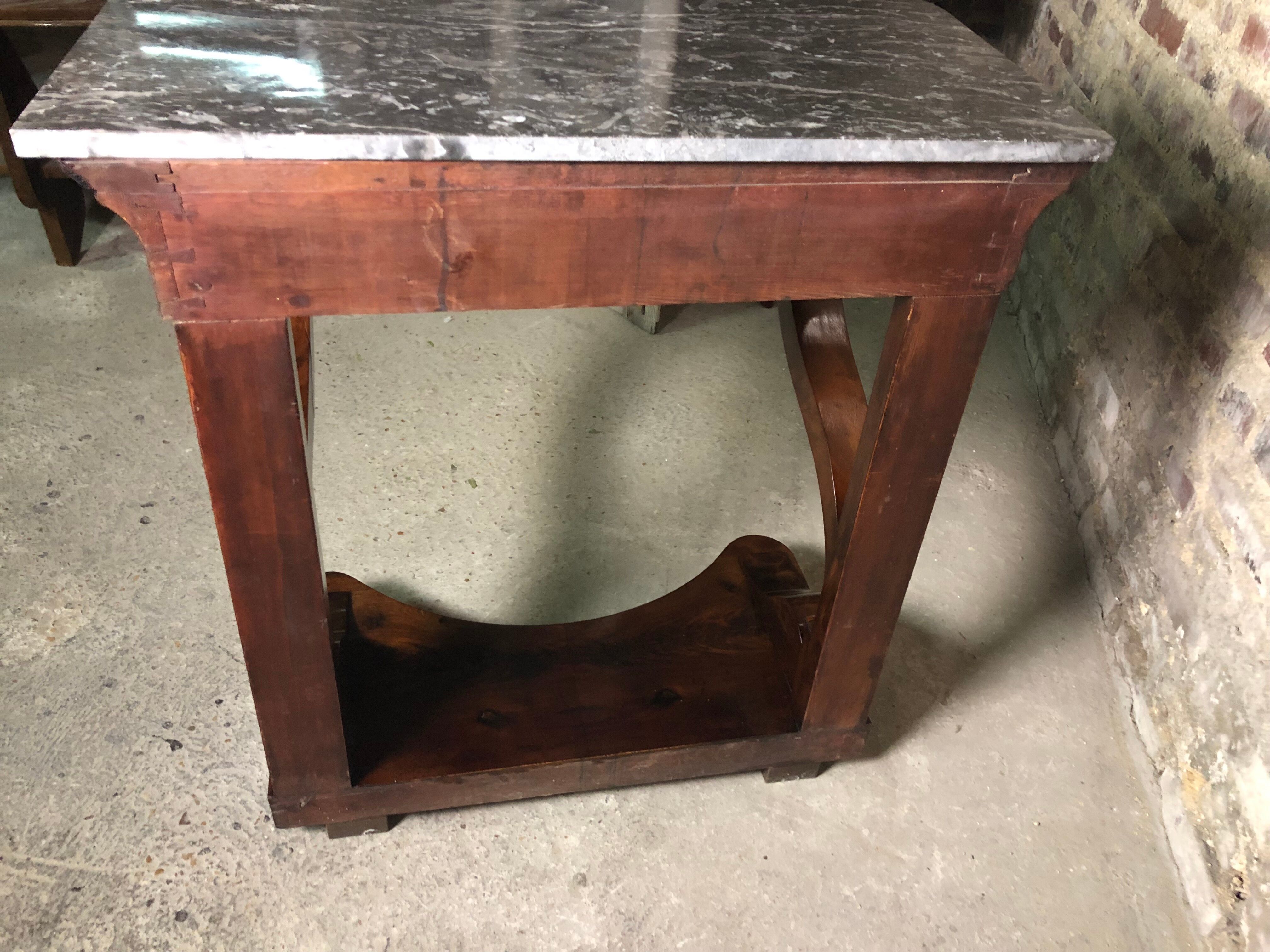 Console era restoration in mahogany veneer with St. Anne marble top.