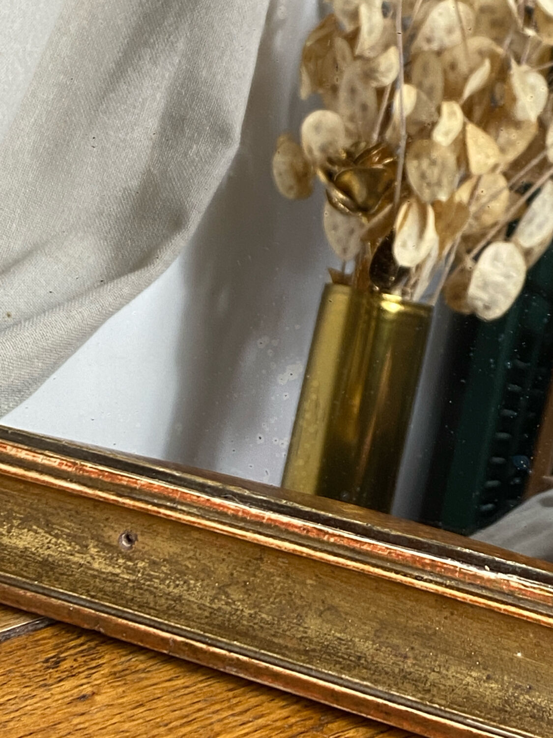 Antique mirror in gilded wood