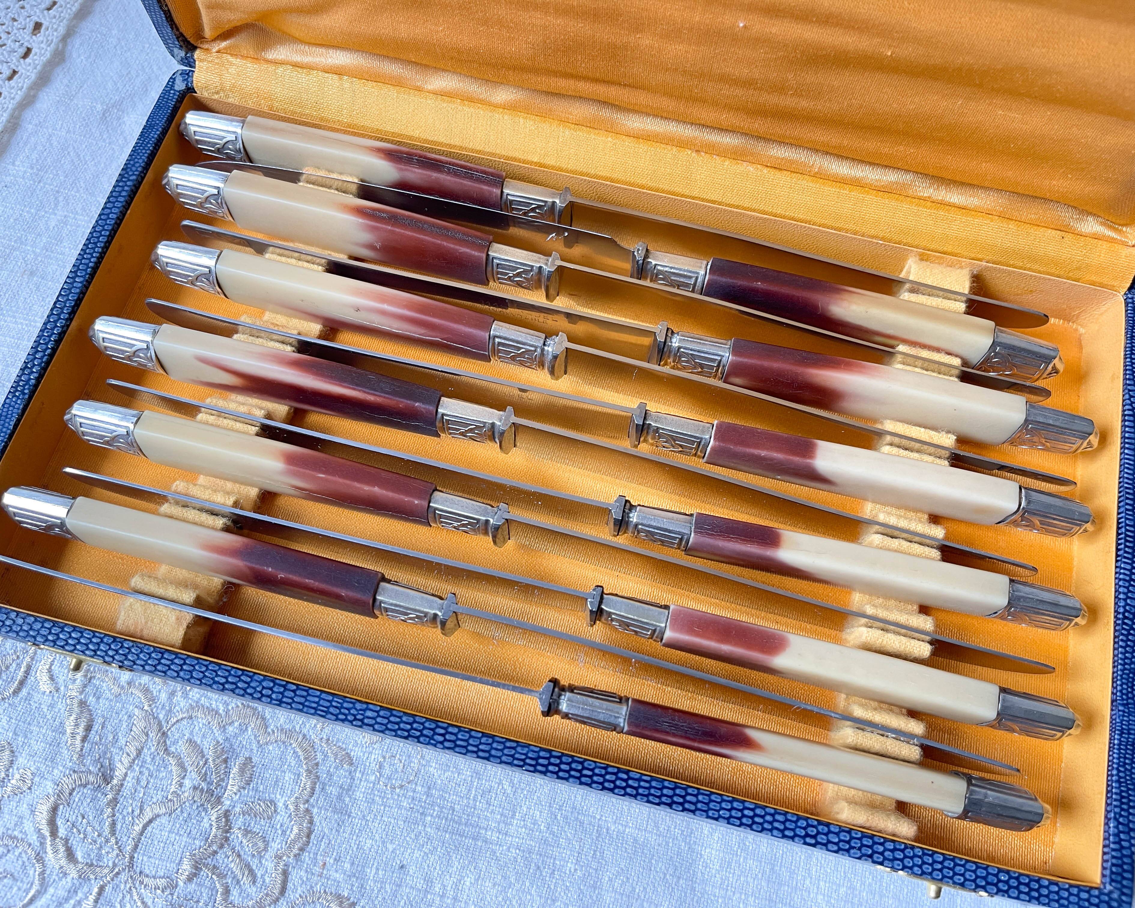 12 vintage Pradel stainless steel bakelite knives