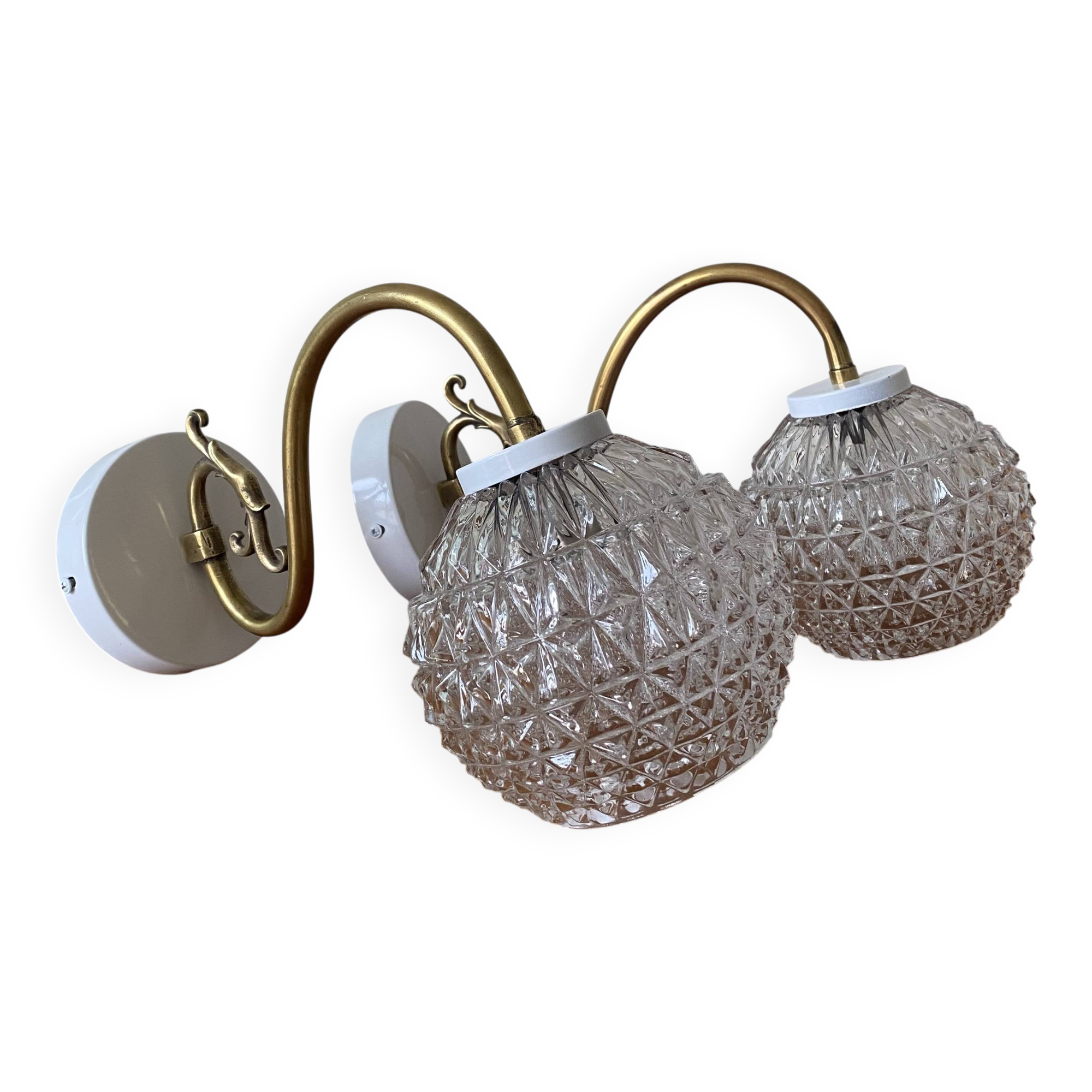 Large pair of brass swan neck wall lights with transparent glass globes.