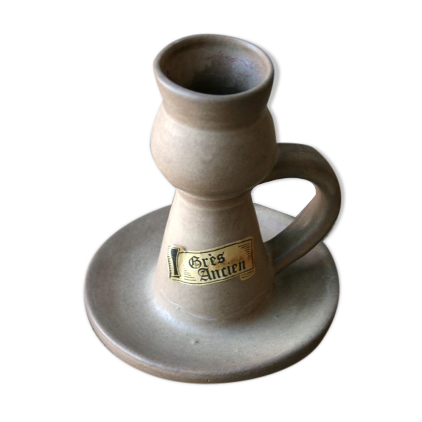 Hand-held sandstone candlestick