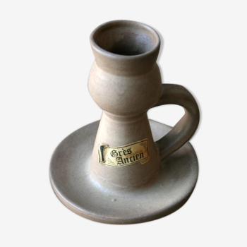 Hand-held sandstone candlestick