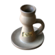 Hand-held sandstone candlestick