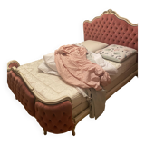 Upholstered bed in rosewood fabric