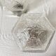 Pair of lantern-style ceiling lights or antique lamps.