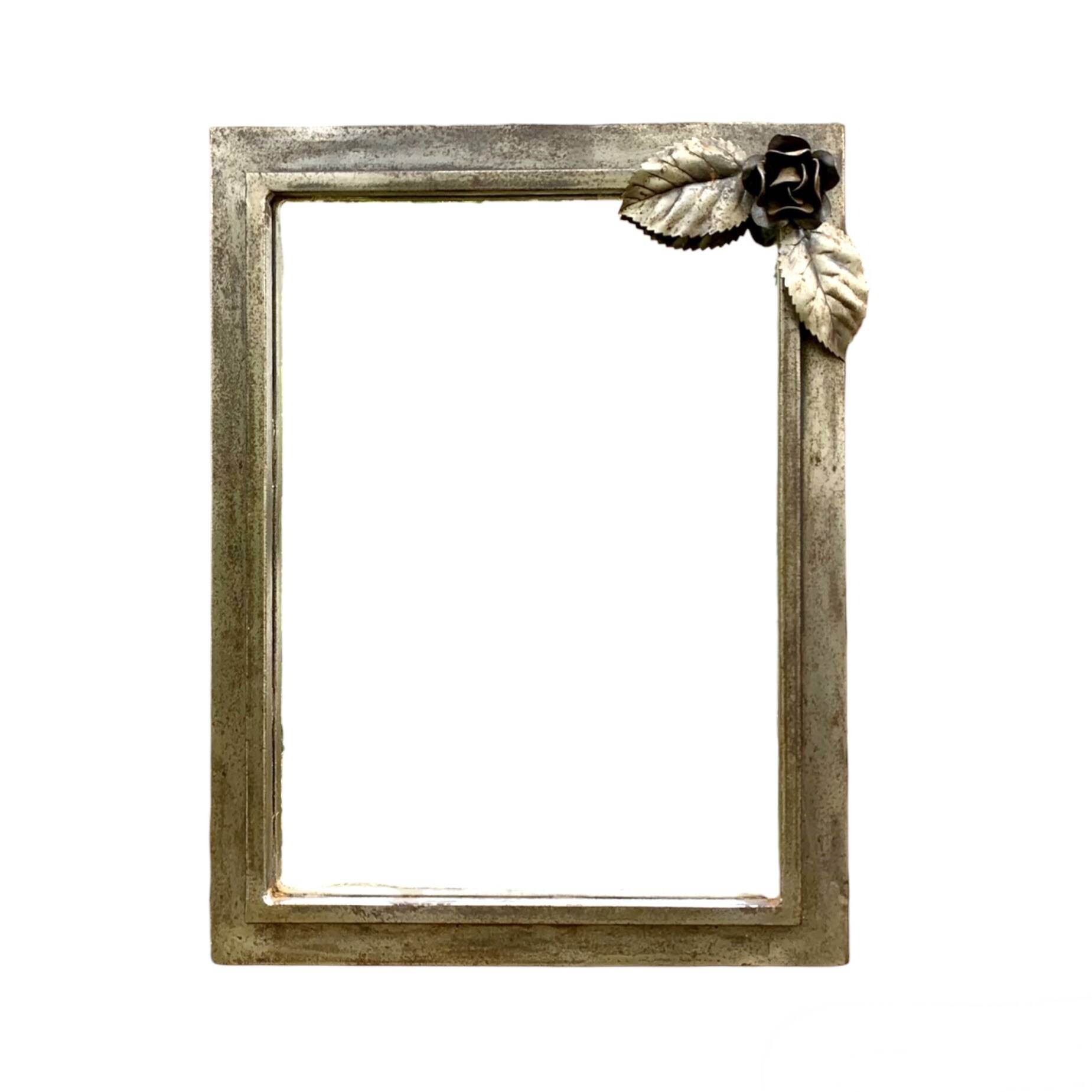 Vintage wall mirror in varnished steel decorated with a rose in relief