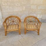 Two large rattan armchairs