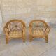 Two large rattan armchairs