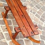 Rustic bench, old folk art, snow sled, Alps.