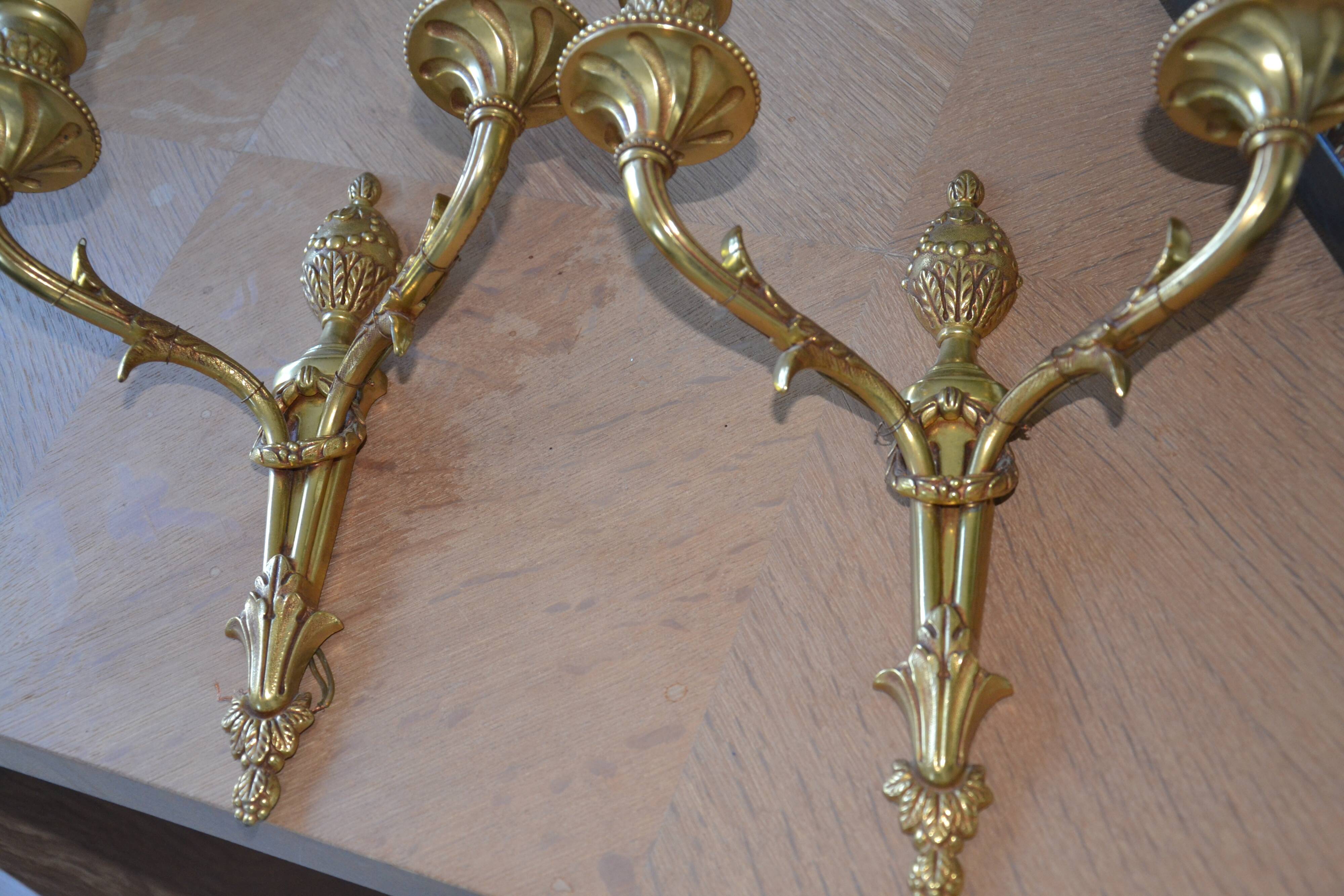 2 sculpted bronze wall lights