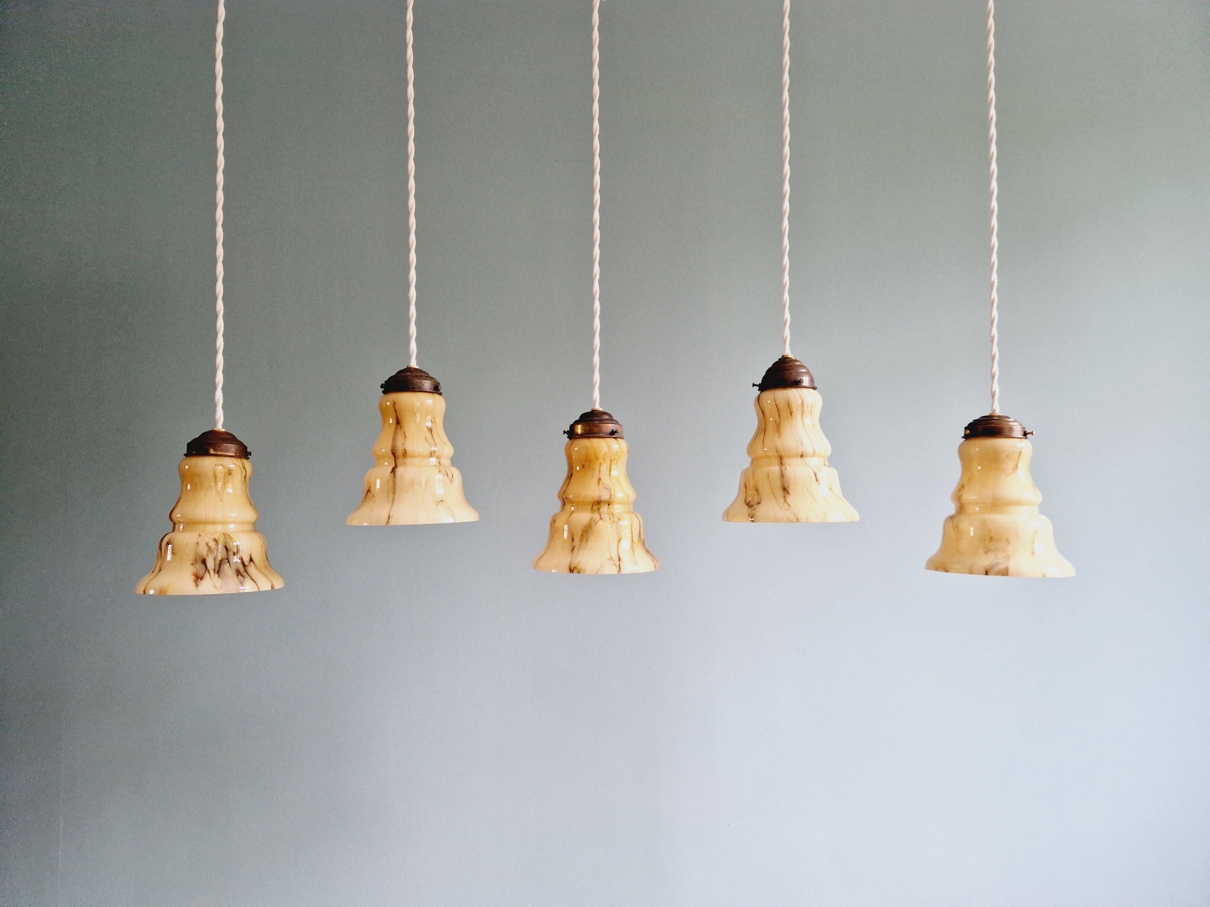 Set of 3 Art Deco marbled opaline pendant lights, 1920s-30s