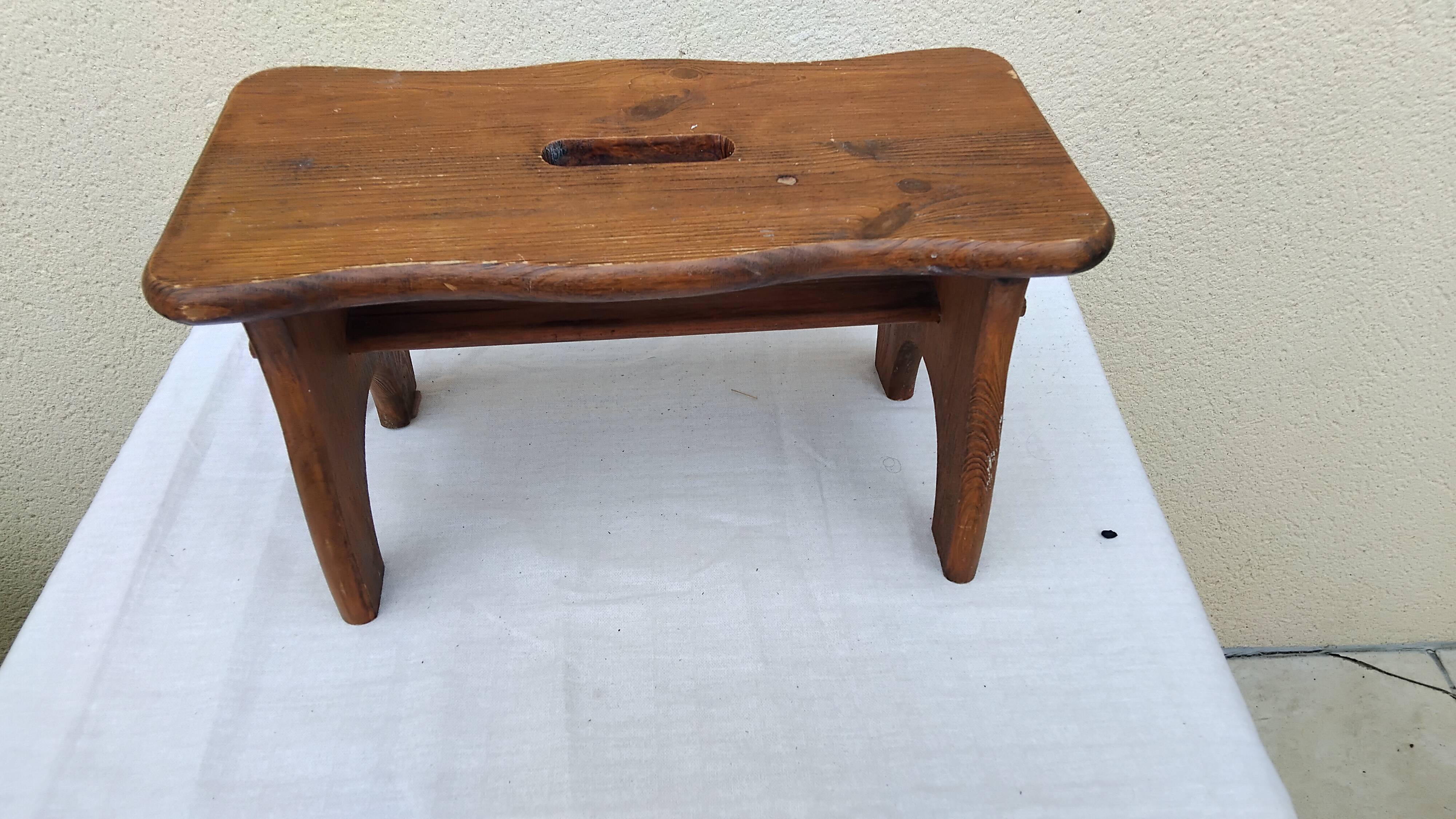 Old small vintage farm stool