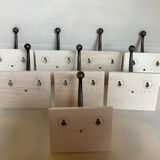 Eight double white wood metal hooks