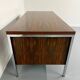 Vintage desk with rosewood veneer and chrome metal design from the 1970s.