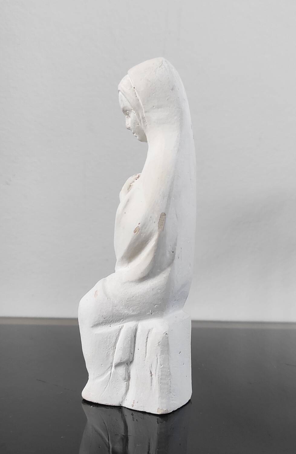 Vintage white plaster statuette of the Virgin Mary.