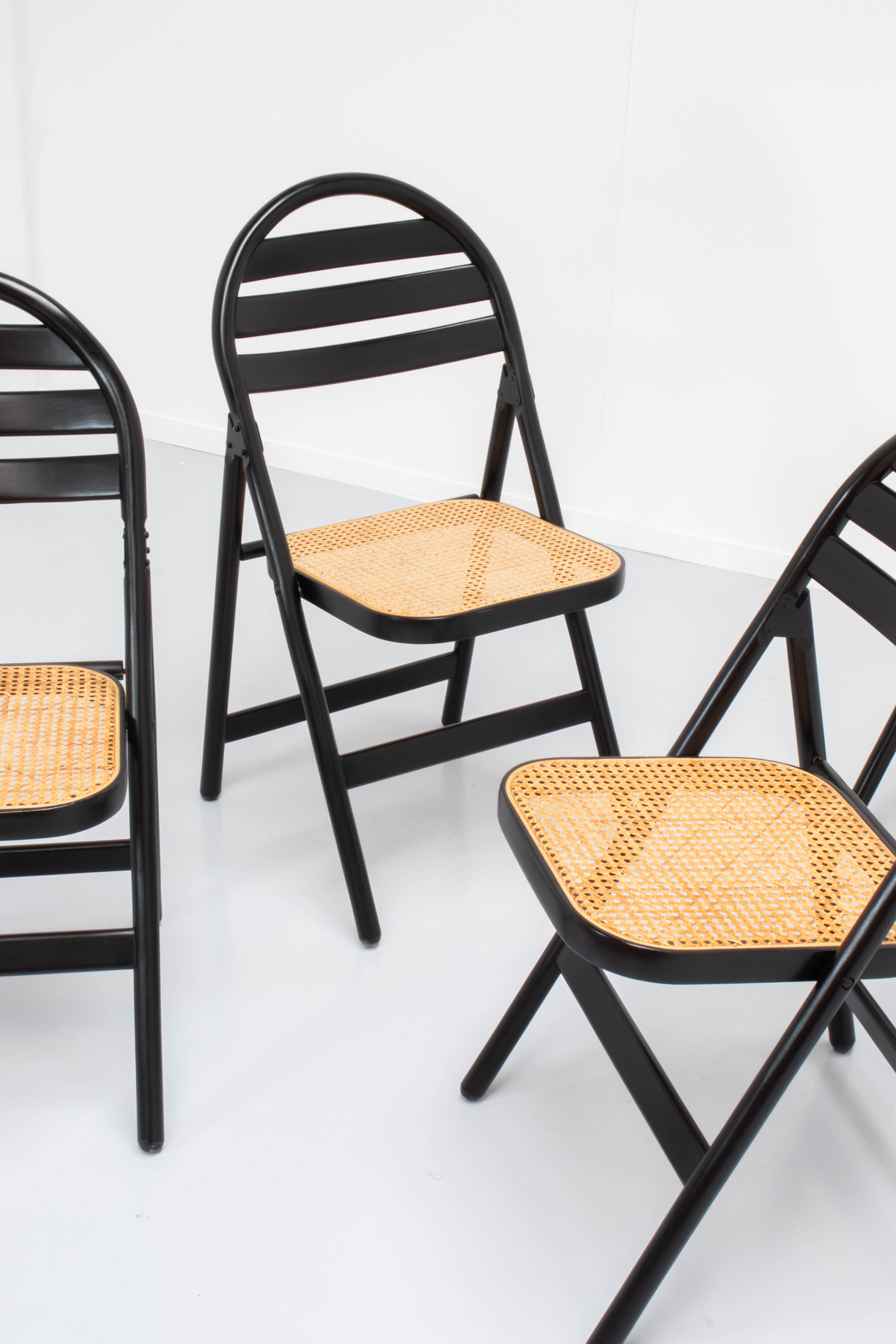 4 vintage wood folding chairs with cane seating