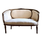 Two-seater basket bench in carved wood and beige mixed fabric, 18th century.