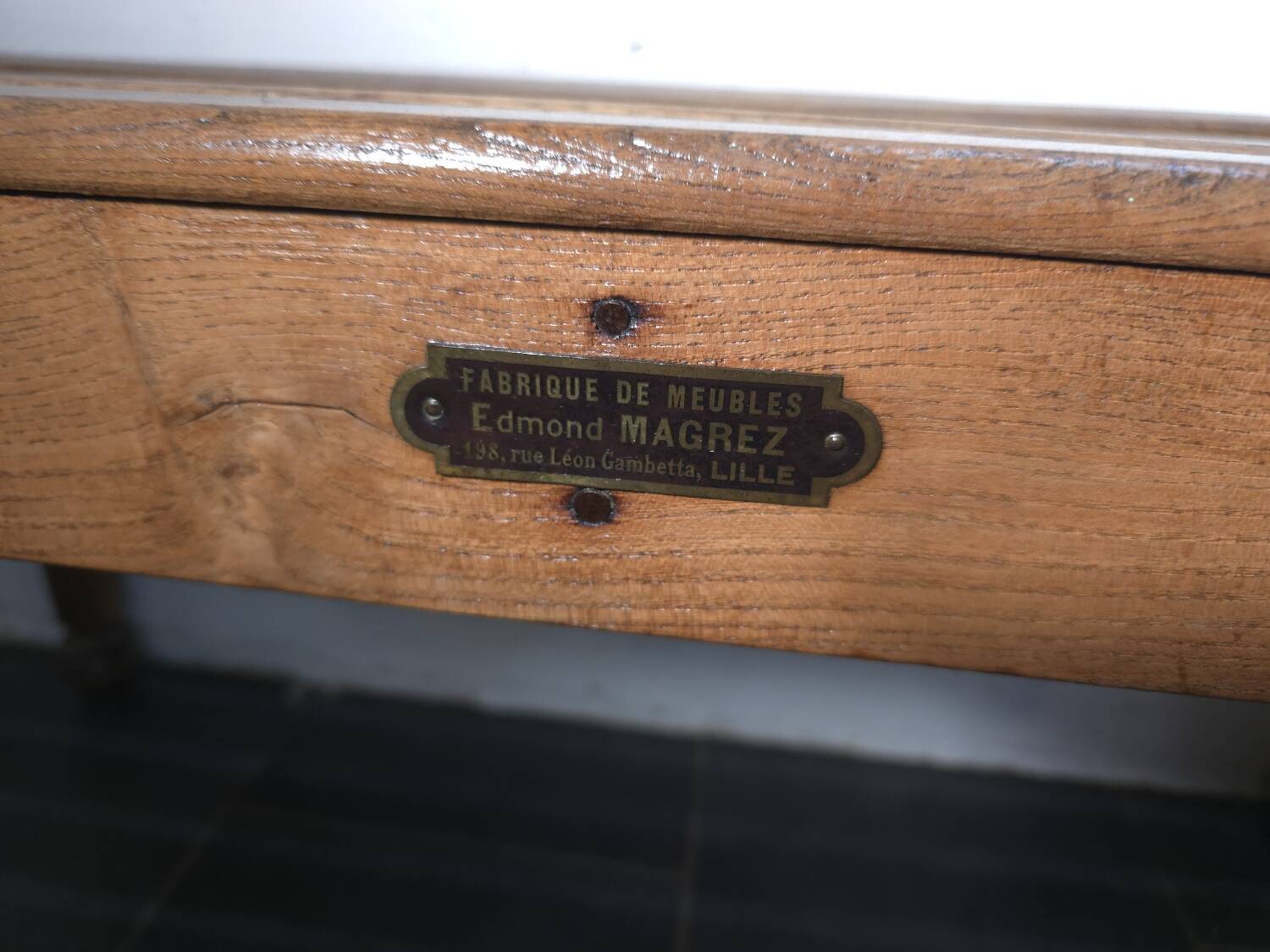 Solid oak workbench with slats signed by Edmond Magrez.