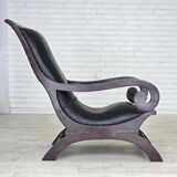 1970s, vintage armchair with footstool, black furniture leather.