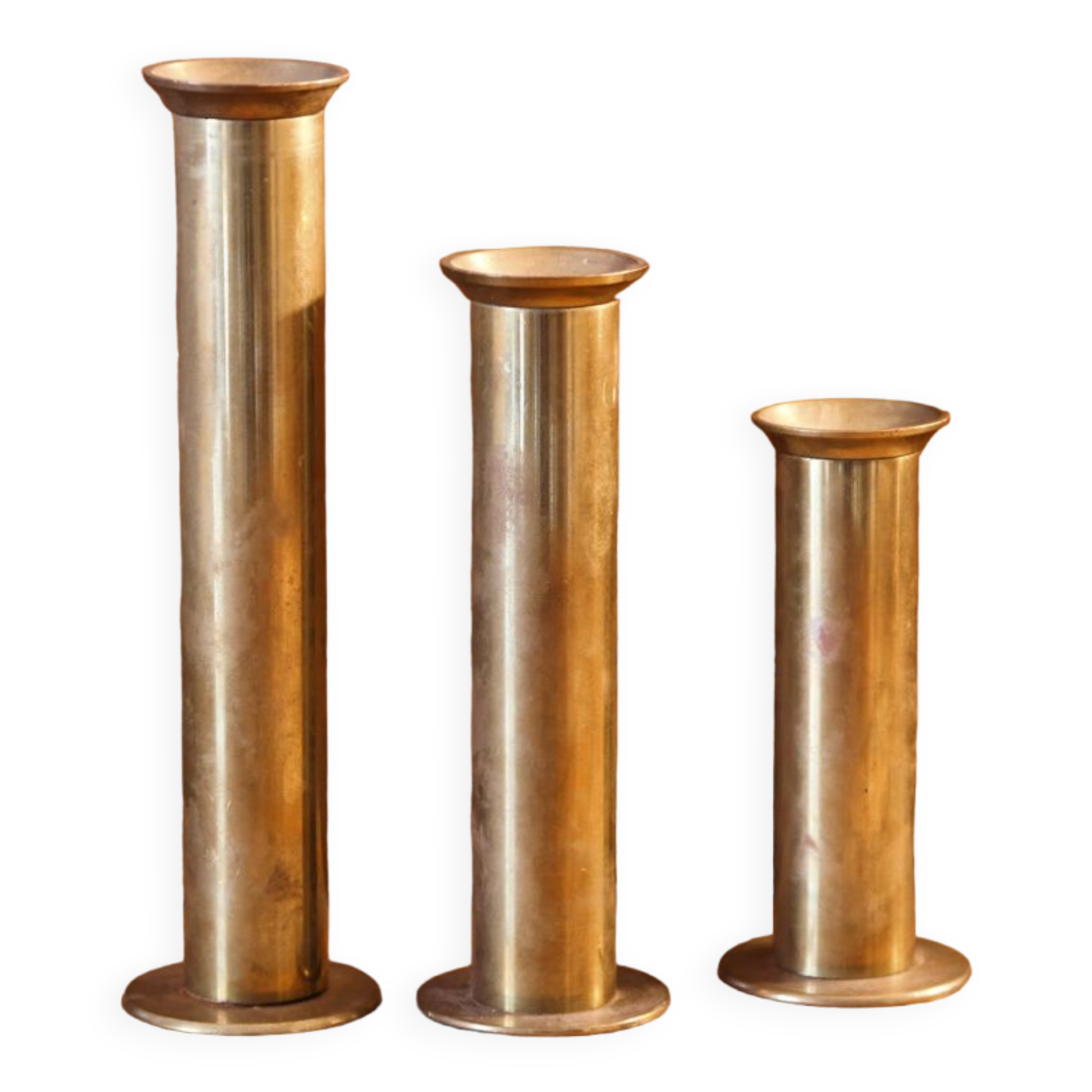 Trio of brass candle holders