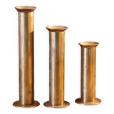 Trio of brass candle holders