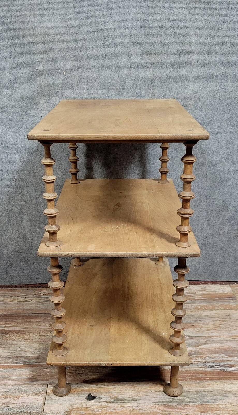 Natural wood display shelf with three tiers