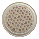 Vintage round trivet, ideal for adding a romantic touch.