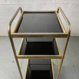 Small rolling trolley in brass and black plastic